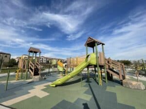 pinehurst park in chino hills with clear blue sky, kids playground, and basketball courts